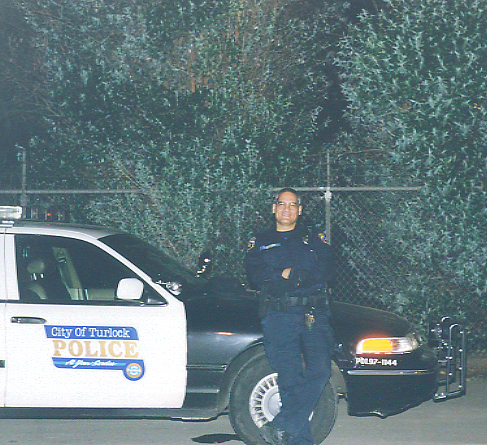 Mr. B. Standing in front of his patrol car